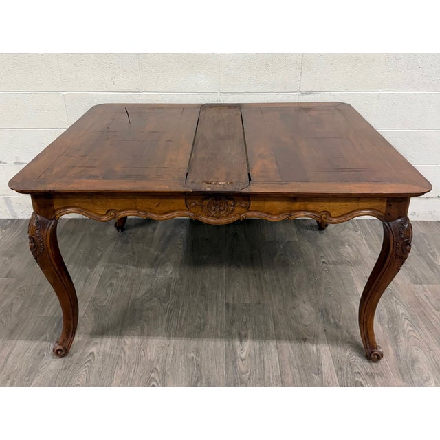 This is an absolutely gorgeous antique French Louis XV, French Provincial, or French Country style draw leaf or refectory...