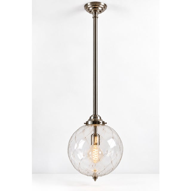 Remains Lighting Sorenson 12 Lantern pendant light, model HL2617.12. The fixture features a clear glass globe with a...