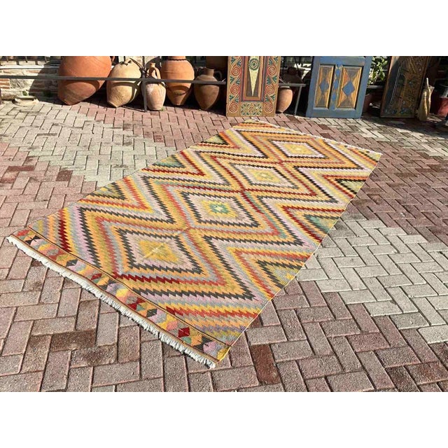 This beautiful, vintage, handwoven Kilim is approximately 60 years old. It is handmade of very fine quality, hand-spun...