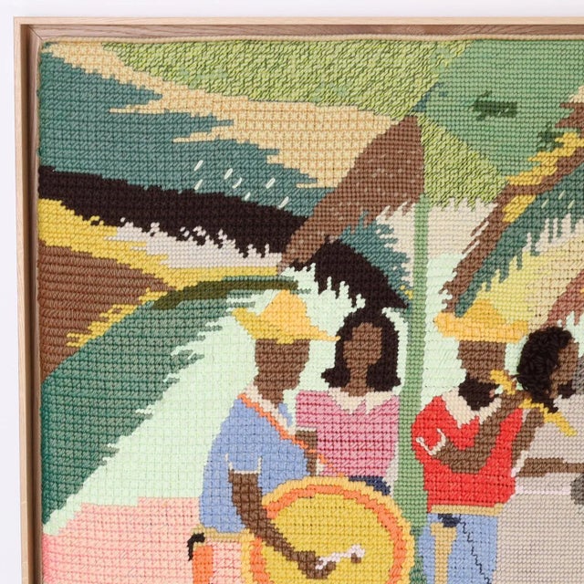 Mid century framed wall hanging depicting a lively bunch of musicians in a tropical setting ambitiously crafted in a...