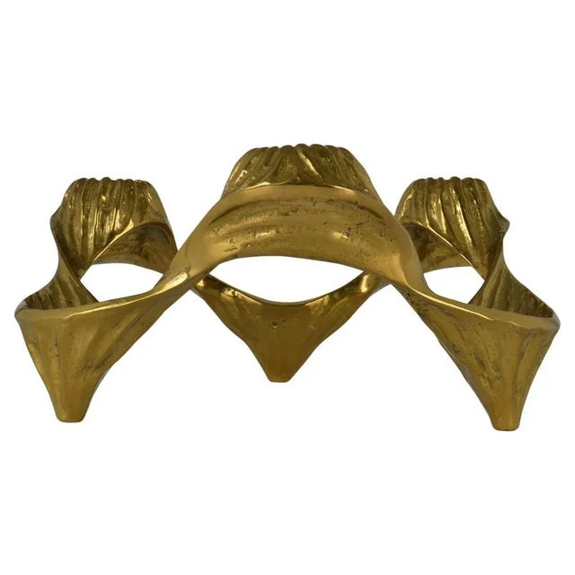 Large organic bronze cast gold tinted candelabra forms a circle of six alternating candles of choice, from regular candles...