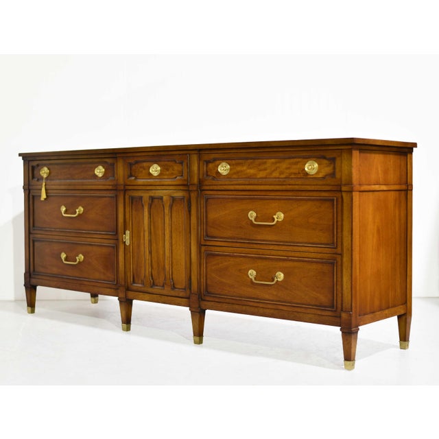 Classic, tailored, and beautifully crafted, this mahogany lowboy dresser by Drexel Heritage combines timeless mid century...