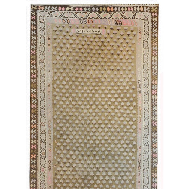 An extraordinary vintage Kurdish Kilim runner with an all-over tree-of-life pattern, woven in natural browns and cream...