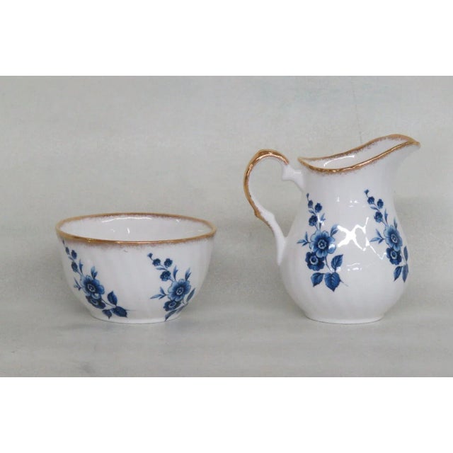 This magnificent creamer and sugar bowl set is made of bone china. This creamer and sugar bowl set is stamped as being...