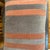Handcrafted decorative pillow case. Grey with coral sunset stripes velvet and solid grey back, 14”X20”, invisible zipper....