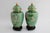 Vintage Pair of Chinese Cloisonne Urn Vases in Gorgeous Green with fine, detailed work. 8” Tall. The wooden stands are...