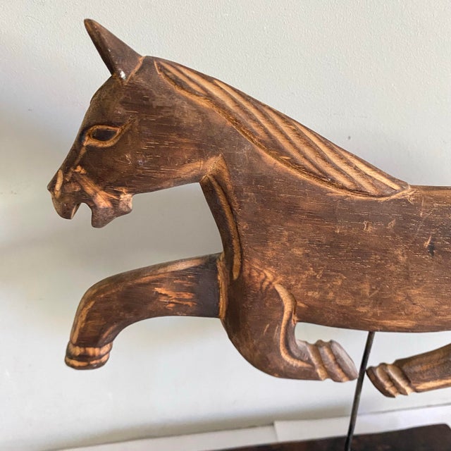 Hand carved wooden horse Folk Art on a wood base. Made by a California Folk Artist.