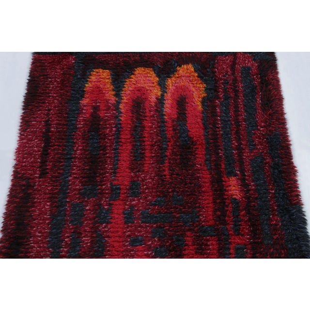 Hand-knotted in lush, high-pile wool in Sweden circa 1960-1970, this 3x5 vintage Swedish Rya rug is a bold new addition to...