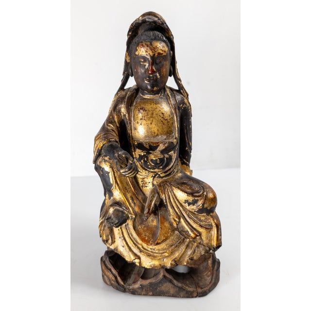 We are offering this beautiful Chinese Ming parcel gilt wood carving. This figure is Ming in period, most likely mid to...