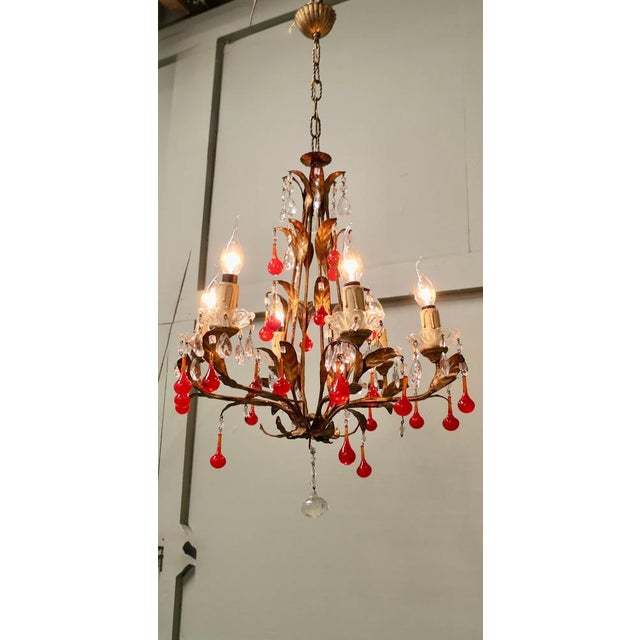 Large French Chandelier Hung with “Lipstick” Red Teardrops This is an amazing piece, the dark gilded toleware frame is...
