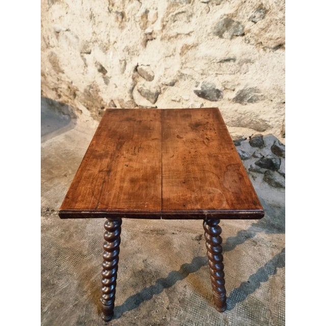 A 19th-century side table featuring a solid walnut top and beautifully hand-turned oak barley twist legs. Dating from...