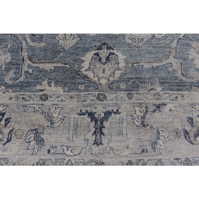 Measures: 12'1 x 14'4 Turkish Angora Oushak Rug with Steel Blue Field and Light Gray Border. Keivan Woven Arts. rug...