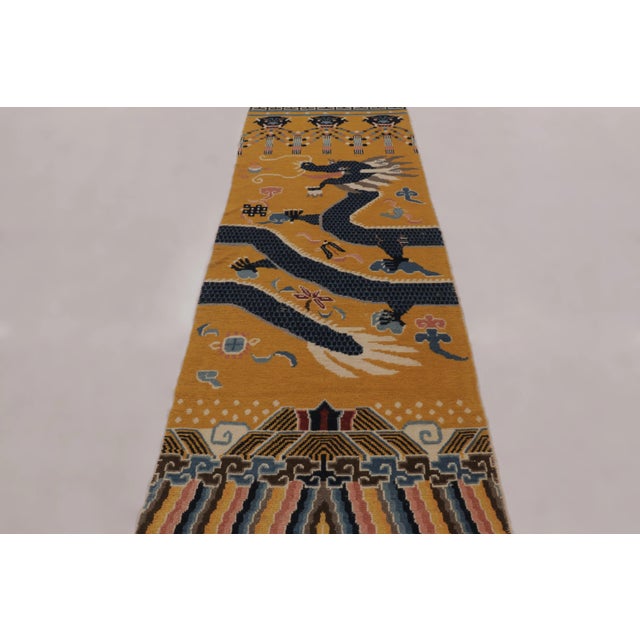 Dating from the late 19th century, circa 1890-1900, this 3x10 antique Chinese runner rug is a remarkable example of a...