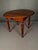 Charming late 19th-century American round dining or occasional table dating to circa 1890. Crafted from solid poplar wood...