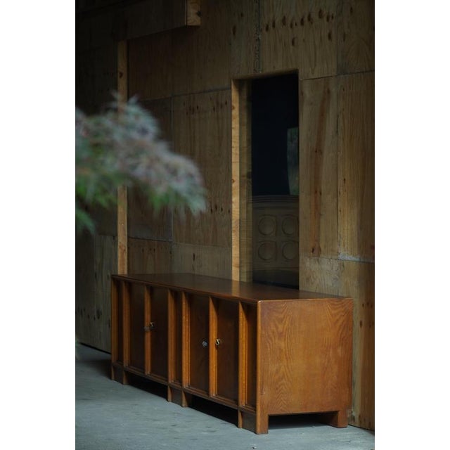 A beautiful and impressive large sideboard in oak, made in Denmark during the 1940s by a skilled cabinetmaker. The...