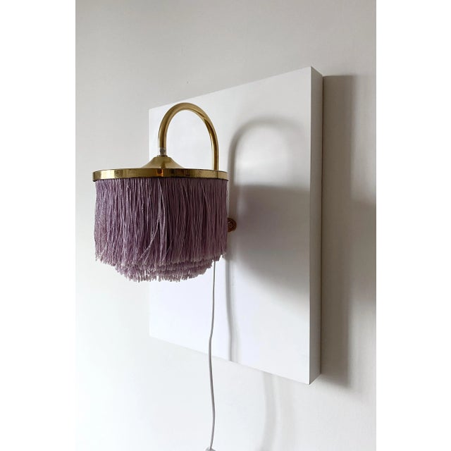 Vintage Wall light modell V271 by Hans-Agne Jakobsson. Part of Hans-Agne Jakobsson now iconic fringe lamp collection this...