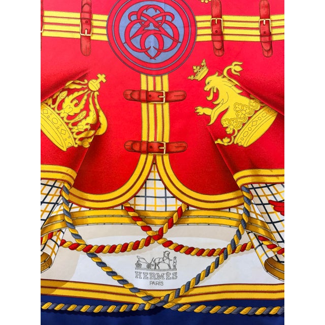 Hermès Grande Tenue silk scarf This scarf refers to the cloth blankets or stable blankets, here carefully secured with...