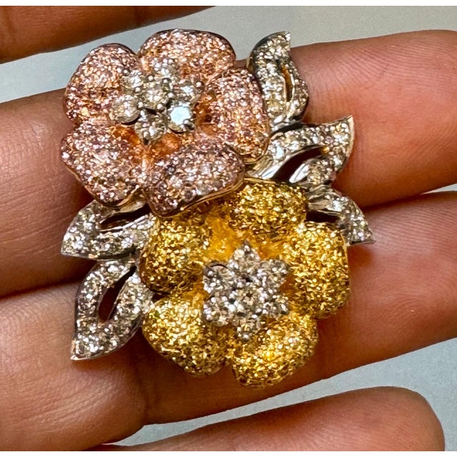 4 Ct Natural Fancy Color Diamond Flower Pin in 18 Karat Multi Color Gold Approximately 4 Ct Natural Fancy diamonds are...