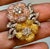 4 Ct Natural Fancy Color Diamond Flower Pin in 18 Karat Multi Color Gold Approximately 4 Ct Natural Fancy diamonds are...
