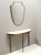 Made in Italy, 1960s. It features a wooden and brass frame. This is a vintage piece, therefore it might show slight traces...