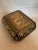 Papier Mache box with gilt painted detailing and top with a carved wood sconce. Interior is painted an oxblood red. Nice...