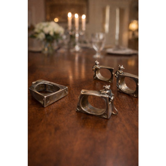 A charming and refined set of four vintage Italian napkin rings, crafted in steel and designed in the playful form of a...