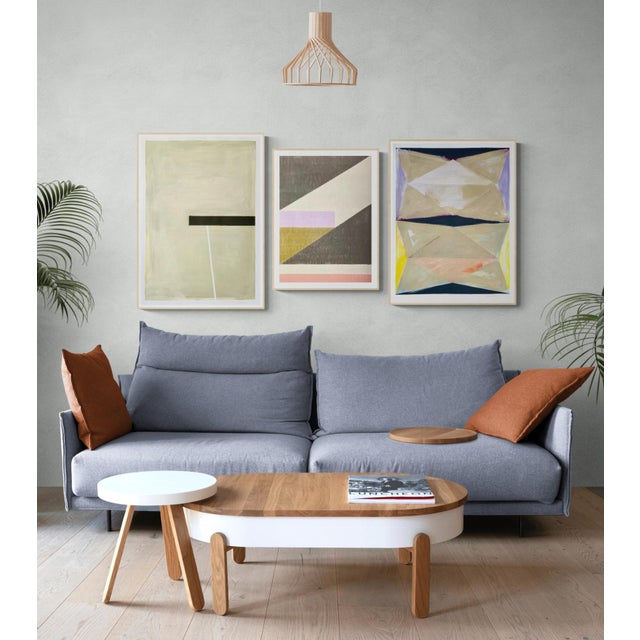 This unique piece features triangle shapes in an orderly stacked formation with details washed out by swaths of beige and...