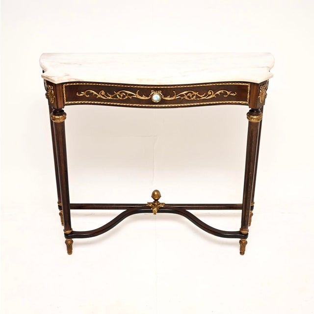 A beautiful antique French marble top walnut console table, dating from around the 1930’s. It is of superb quality, with...