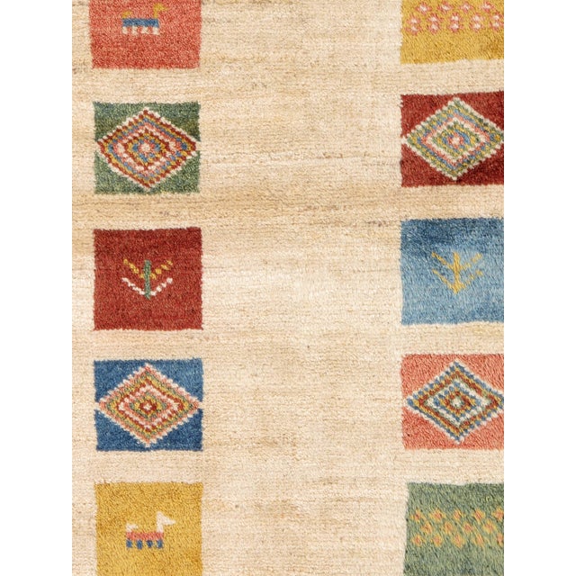 1980s Hand-Knotted Persian Gabbeh Rug With Animal Motifs 4'11" X 6'5" For Sale - Image 4 of 5