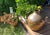 An impressive, large vessel made of hand-hammered copper, originating from Egypt. Its distinctive, spherical shape—with a...