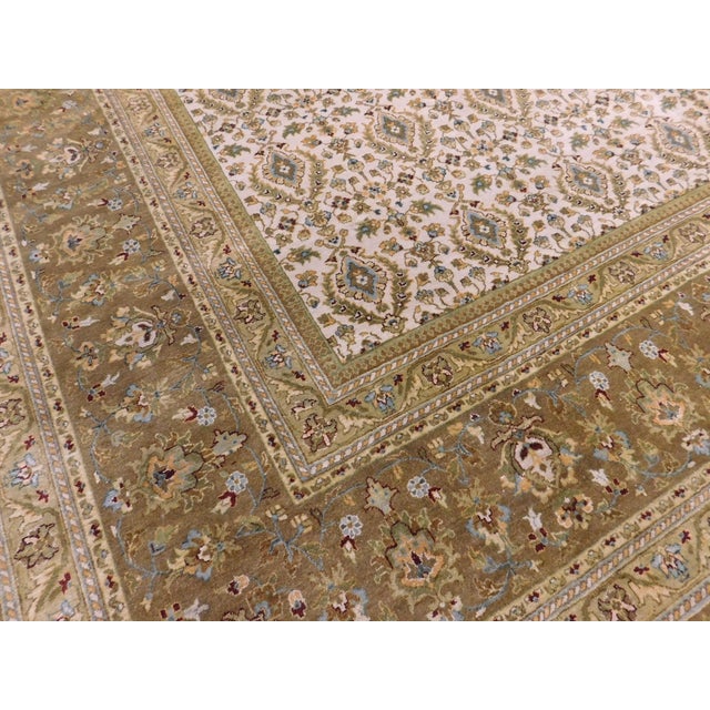 Allover floral motif on ivory background. Wool pile on cotton foundation. 8'x 10'.