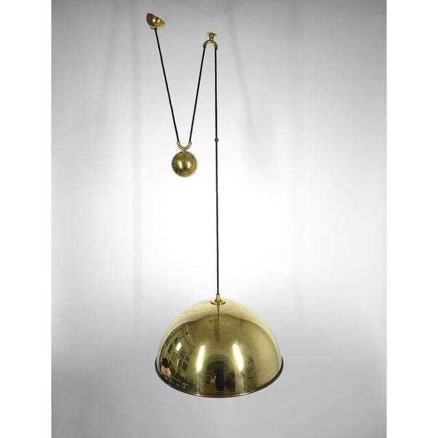 Large brass pendant lamp by German designer Florian Schulz, who had it manufactured in his own family business, Florian...
