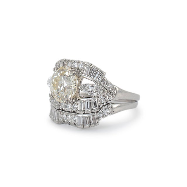 Gender: Ladies Metal Type: 900 Platinum Ring Size: 7 Width: 19.60 mm tapering to 15.75 mm Thick: 2.80 mm Weight: 9.89...