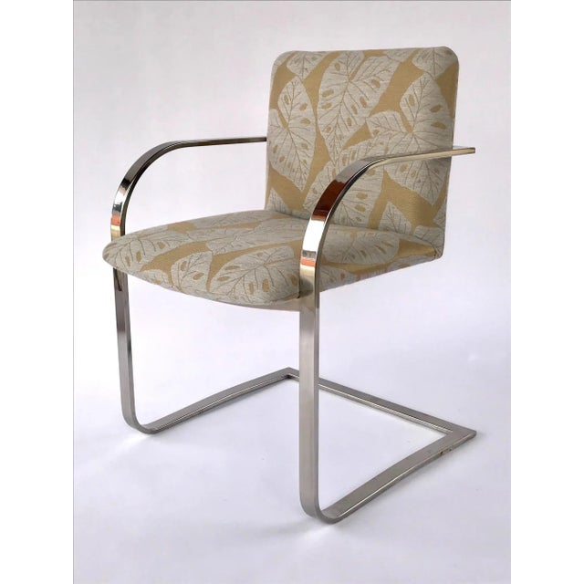 Mid-Century modern desk chair or side chair with cantilevered steel frame in chrome. Chair has streamlined profile with...