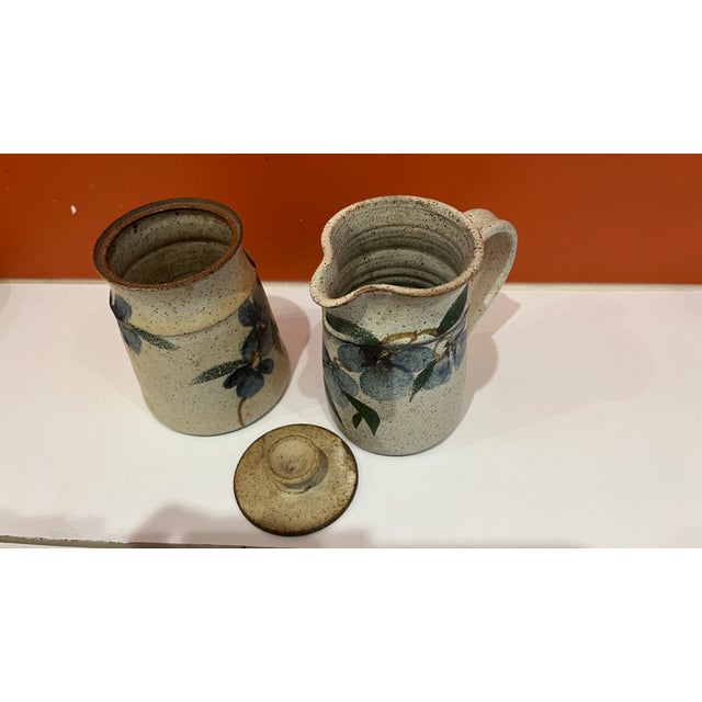 Lily Schor is a longtime ceramic artist and sculptor known for both functional pottery and expressive clay face...