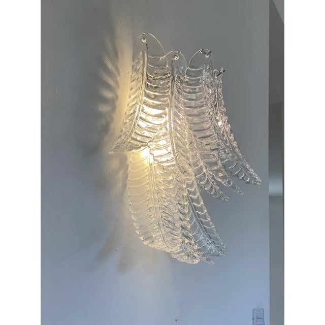 Contemporary trasparent “FELCI ” wall sconces . Felci are hand made from masters of Murano Glass. Made with a traditional...