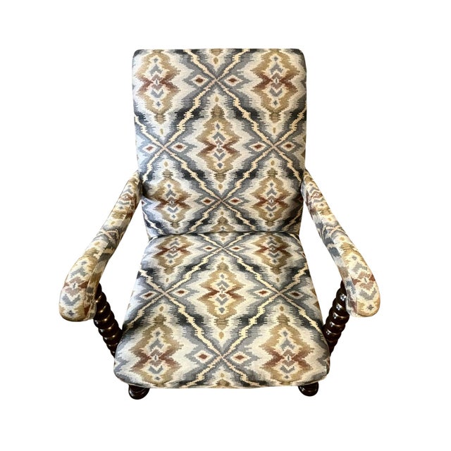 This Spanish Colonial Revival armchair from the later 20th century is excellently upholstered in a heavy cotton blend...