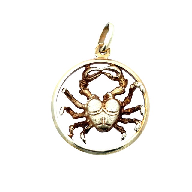 Classic Cancer zodiac pendant crafted in 14K yellow gold, featuring a detailed crab motif set within a circular open-frame...