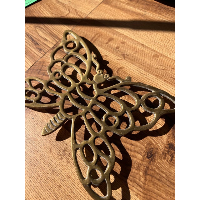 Up for consideration is a beautiful vintage brass butterfly trivet. This would look lovely in your home and it is a great...
