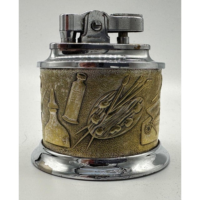 2-3/8" dia. by 2.25" tall plated metal table lighter issued as a gift from DC Comics to their biggest distributors in the...