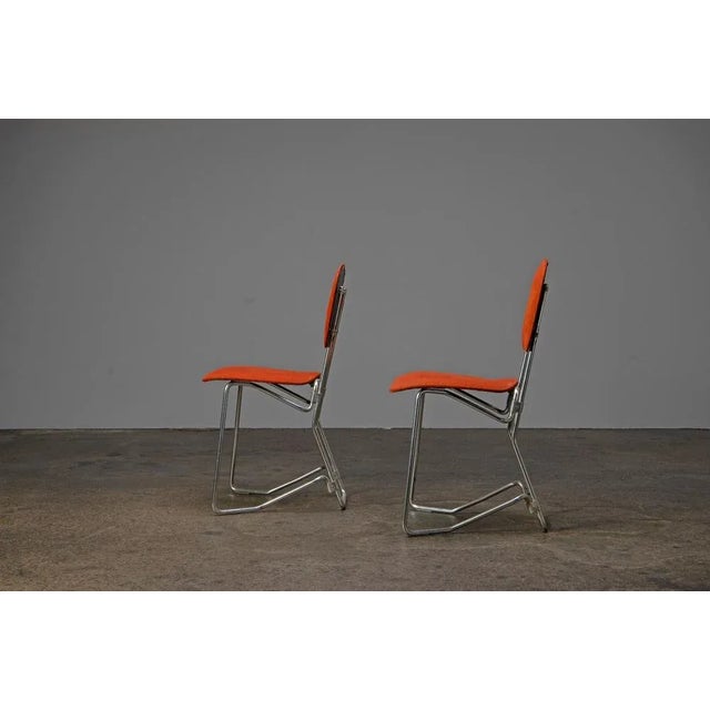 Two aluminum folding chairs with light padding. The chairs are in good condition. One of the chairs has a slight wear on...