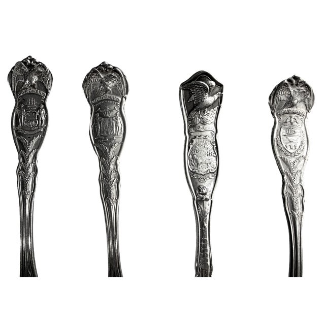 An excellent 14-piece collection of antique and vintage silver-plated souvenir teaspoons showcasing the historic "Stately"...