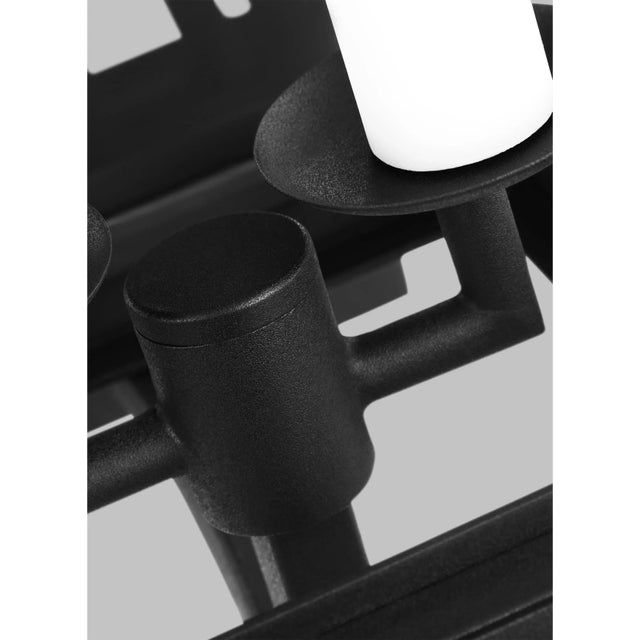 The Hyannis two light outdoor wall fixture in textured black by Chapman & Myers has a classic copper lantern profile with...