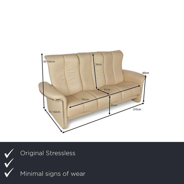 The three-seater Soul from Stressless is covered in cream-colored leather and stands on floor-to-ceiling side panels. It...