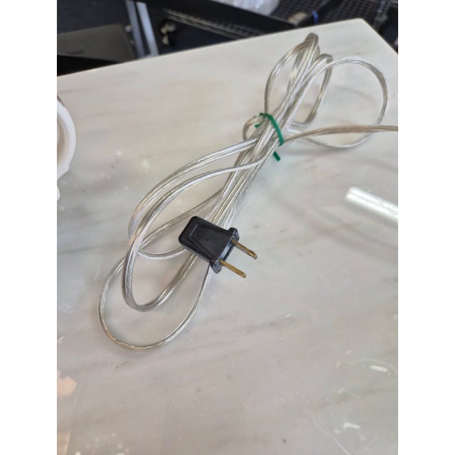 The glass on this lamp was made by the St. Clair Paperweight Glass Company around the 1960's in Indiana. Each glass break...