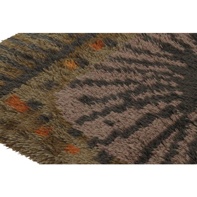 Hand-knotted in lush, high-pile wool in Sweden circa 1960-1970, this 5x6 vintage Swedish rya rug is a bold new addition to...