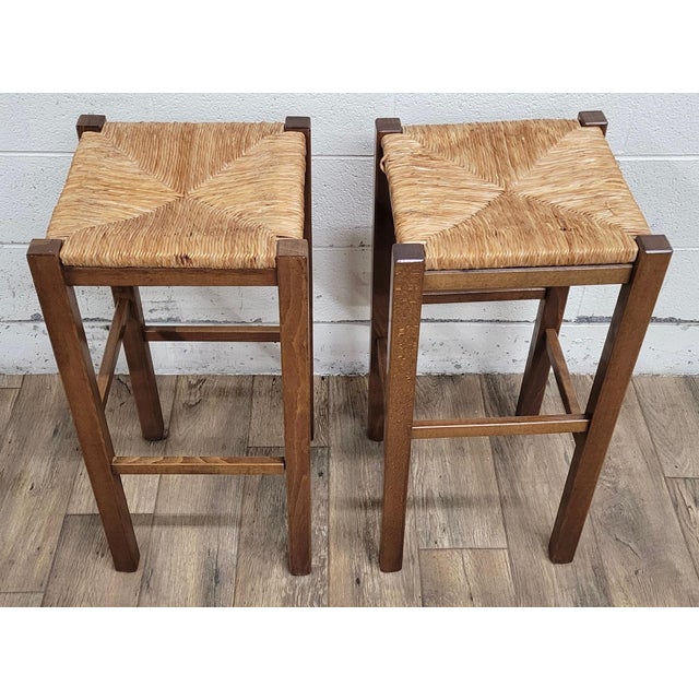 This is a gorgeous pair of rush seat bar stools by Bath and Body Works. Solid and sturdy, with minor cosmetic...