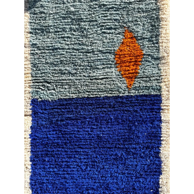 Bring a bold and contemporary touch to your interior with this modern Moroccan runner rug, entirely handwoven in Morocco...
