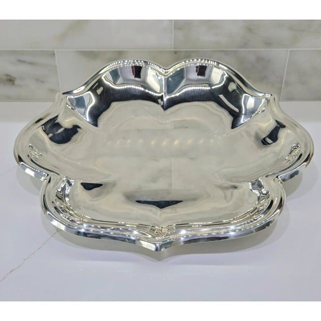 Elevate your home decor or entertaining experience with this beautifully crafted vintage silver-plated serving platter by...