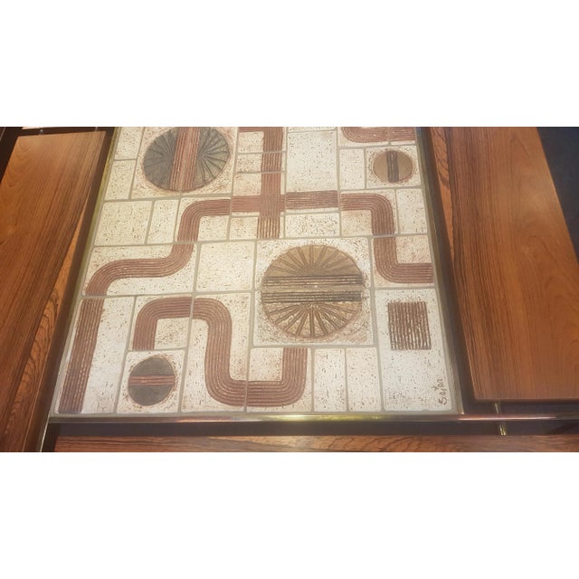 Coffee Table in Rosewood with Brass and Ceramic by Svend Aage Jessen, in Flawless conditions. Designed 1980 to 1989 This...